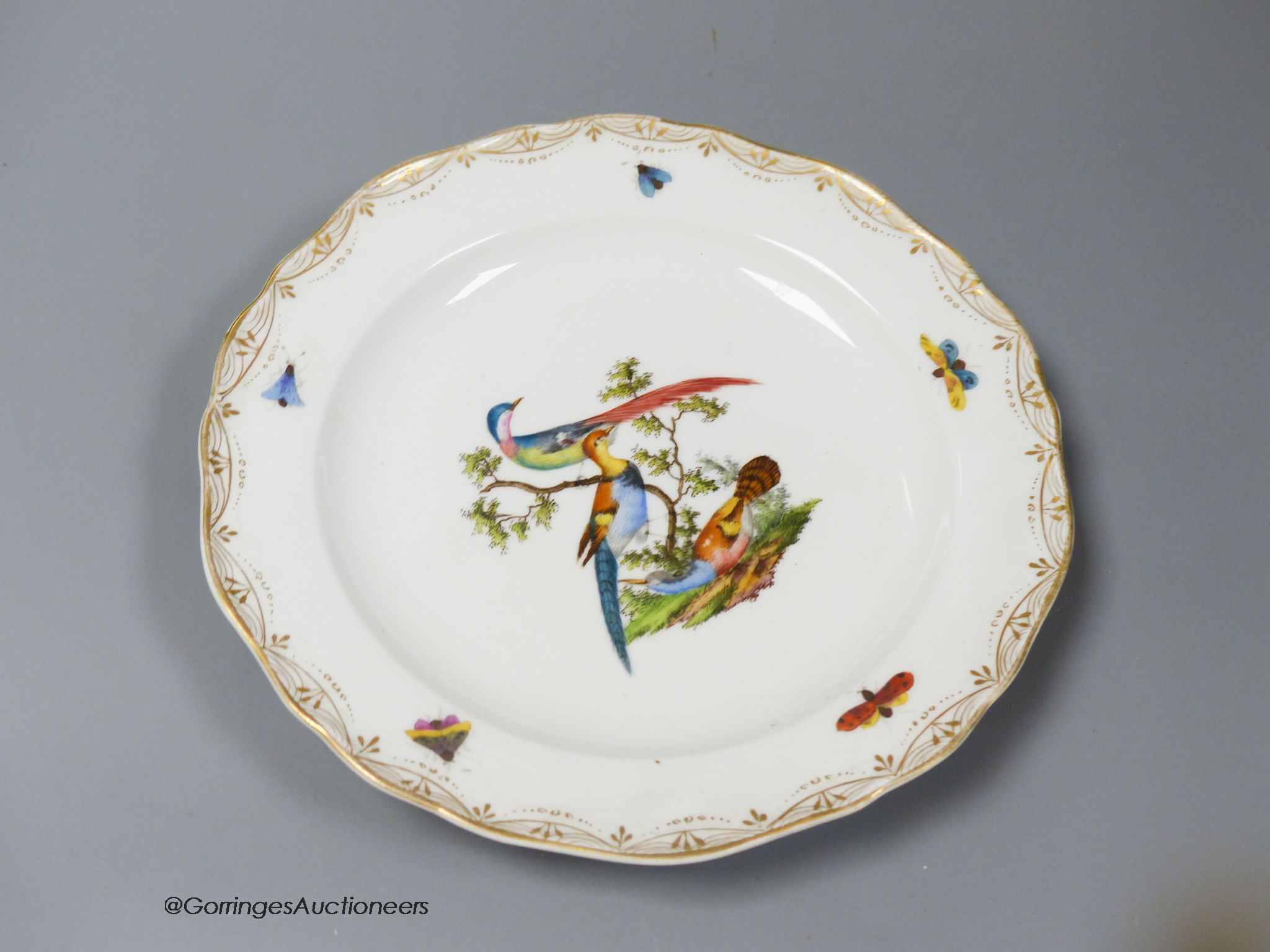 A set of six Meissen dessert dishes, painted with birds,factory seconds, 25.5cm diameter